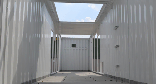 Interior of a 40-foot generator enclosure with custom cut outs for additional industrial equipment. Interior of a 40-foot generator enclosure with custom cut outs for additional industrial equipment.