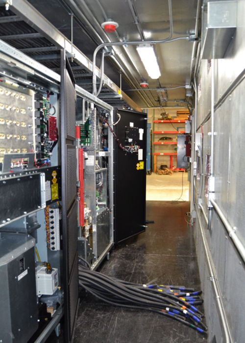 Interior of UPS system in modular equipment shelter with cabling. Interior of UPS system in modular equipment shelter with cabling.