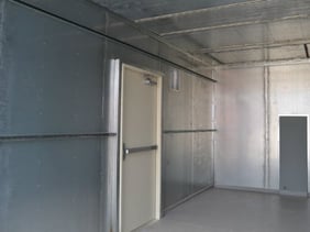 Stainless steel lines the interior of modular shelter for water treatment