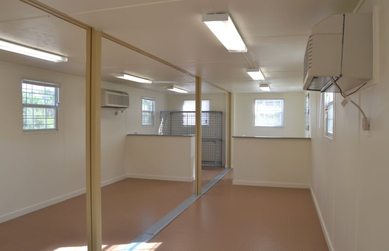 Interior of an office made from two merged shipping containers. Interior of an office made from two merged shipping containers.