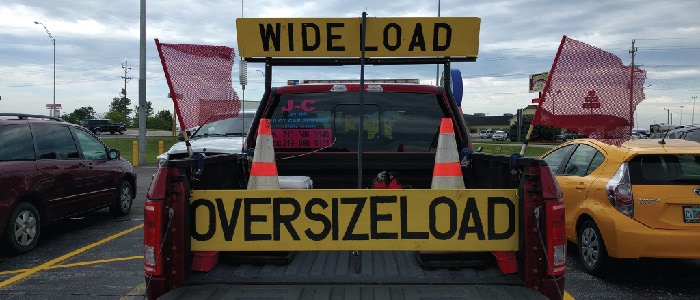 Lead car that may be needed if you are transporting oversize loads for modular construction.