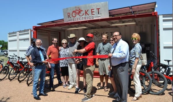 John Dawson, Nicole Zinn, and the Austin Chamber of Commerce cut ribbon on new store front.