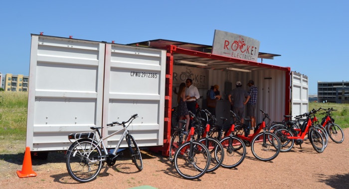Satellite store front with fully open side doors and solar panels. Satellite store front with fully open side doors and solar panels.