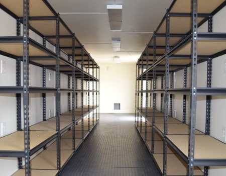 Interior of an onsite storage container with shelving. Interior of an onsite storage container with shelving.