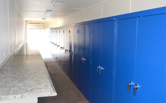 Interior or onsite storage container with work surface and cabinets. Interior or onsite storage container with work surface and cabinets.