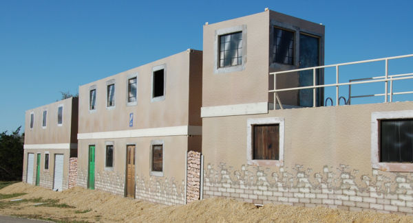 Two level MOUT structure with plaster facades.