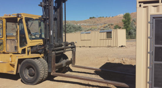 A forklift quickly assembles a conex container training facility for police and firefighters. A forklift quickly assembles a conex container training facility for police and firefighters.