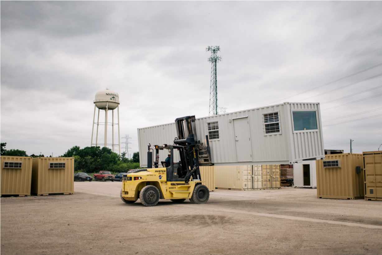 Forklift relocates container office for reuse