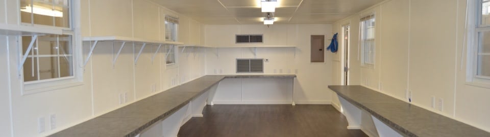 Shipping Container Workspace interior with desks and shelves Shipping Container Workspace interior with desks and shelves