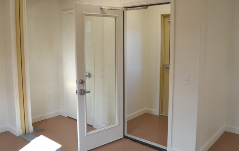 Foyer area inside of double-wide, 16-foot wide, container office. Foyer area inside of double-wide, 16-foot wide, container office.