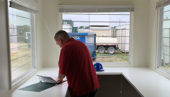 Interior of mobile field office with windows and desk space. Interior of mobile field office with windows and desk space.