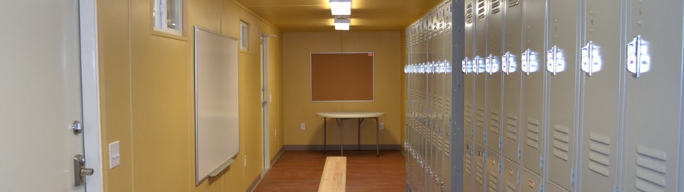 Shipping container converted into a mobile locker room with climate control and benches. Shipping container converted into a mobile locker room with climate control and benches.