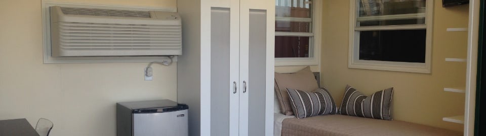 Living shipping container with bed and work area Living shipping container with bed and work area