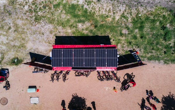 Aerial shot of Rocket Electrics' solar powered shipping container store front.