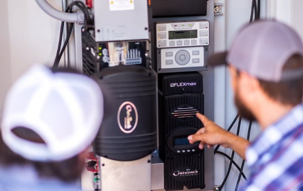 Meters inside of container structure report solar power production.