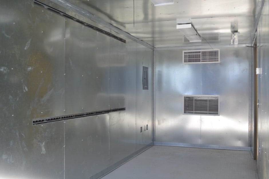 interior shipping container with metal walls and ceiling