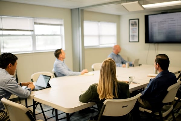 Private meeting space in functional shipping container workspace