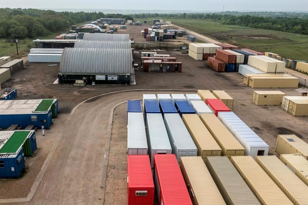 many modified shipping containers on a manufacturing site