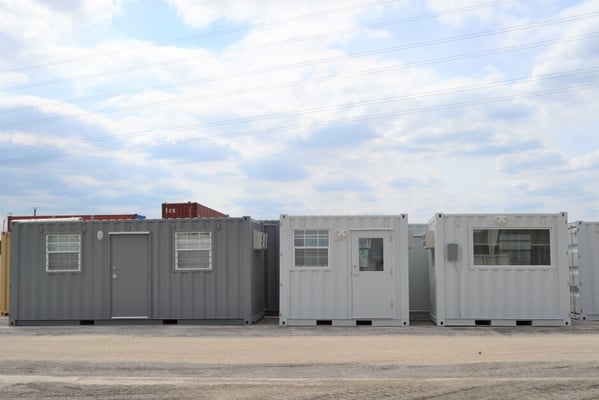 one 20-foot gray shipping container office two white 10-foot shipping container offices