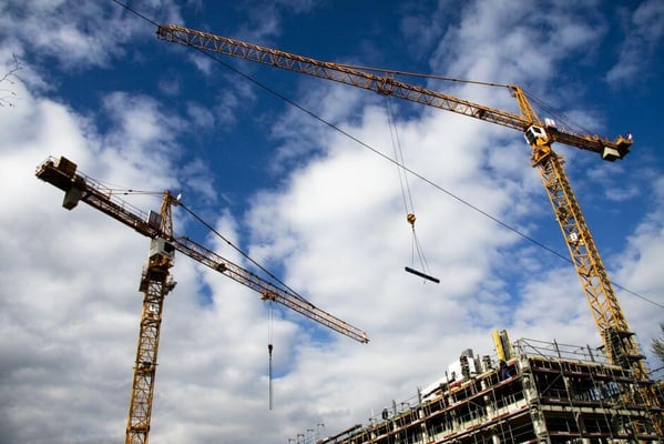 Two cranes on a construction site