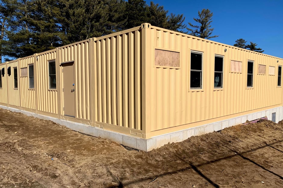 shipping container structure on a concrete foundation