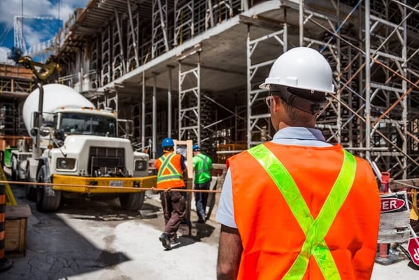 construction worker observing construction work