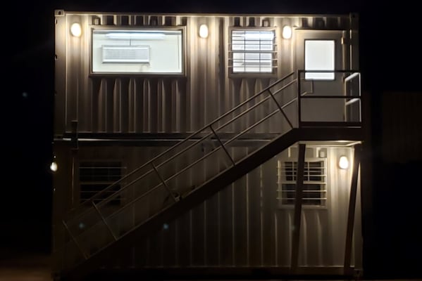 multi container structure lit at night