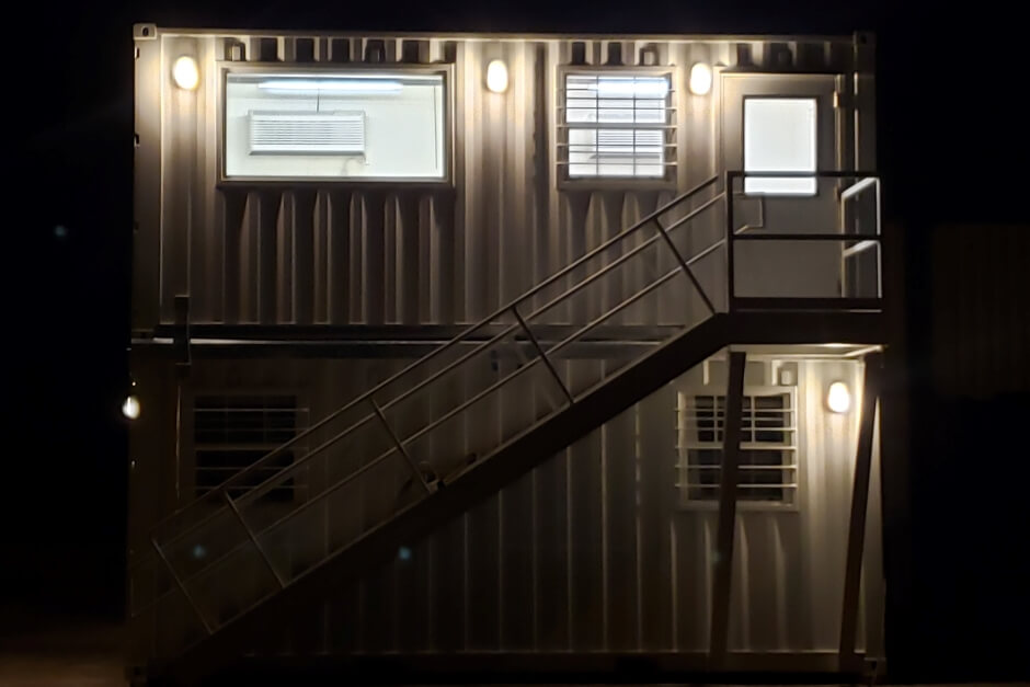 multi container structure lit at night