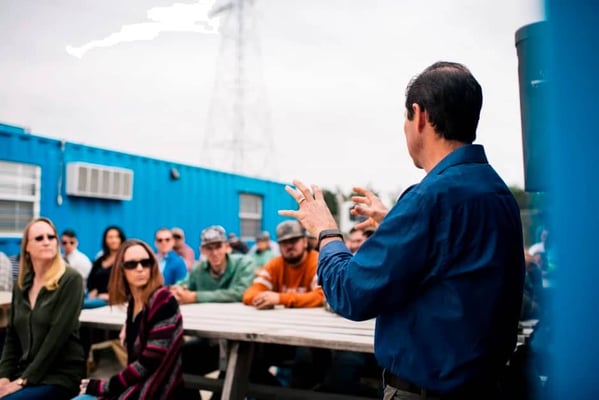 outside meeting at a container modification company