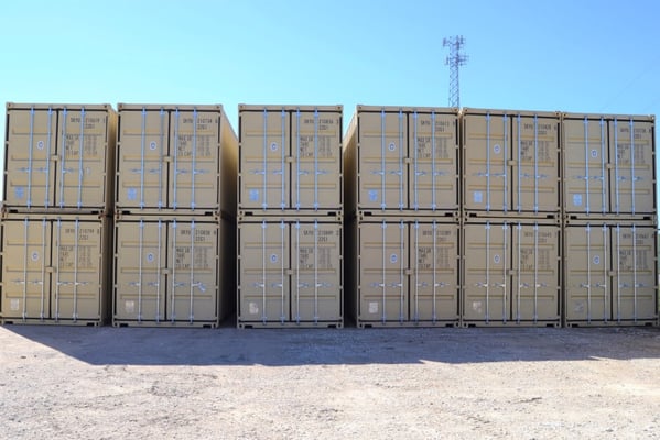 stacked shipping containers in a row