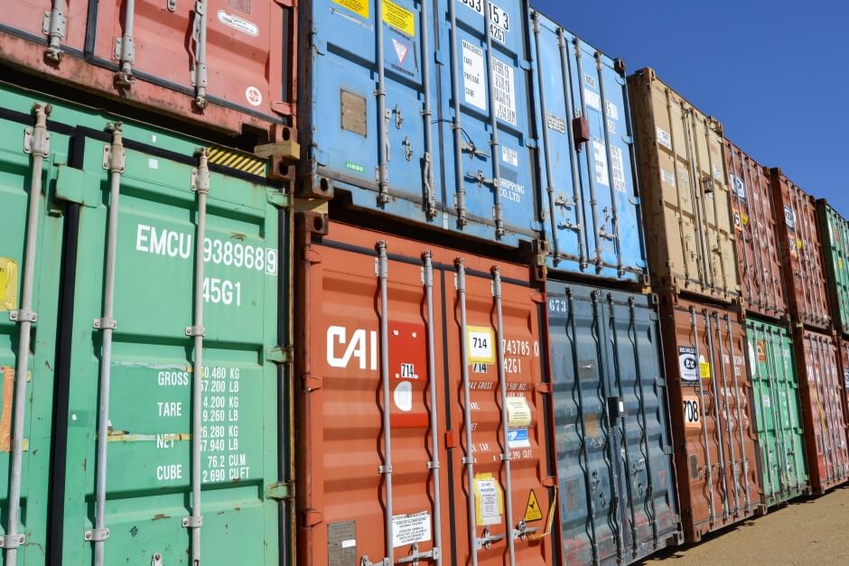 multi-colored shipping containers in stacks