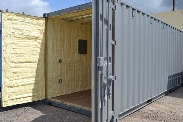 grey shipping container with spray foam insulation