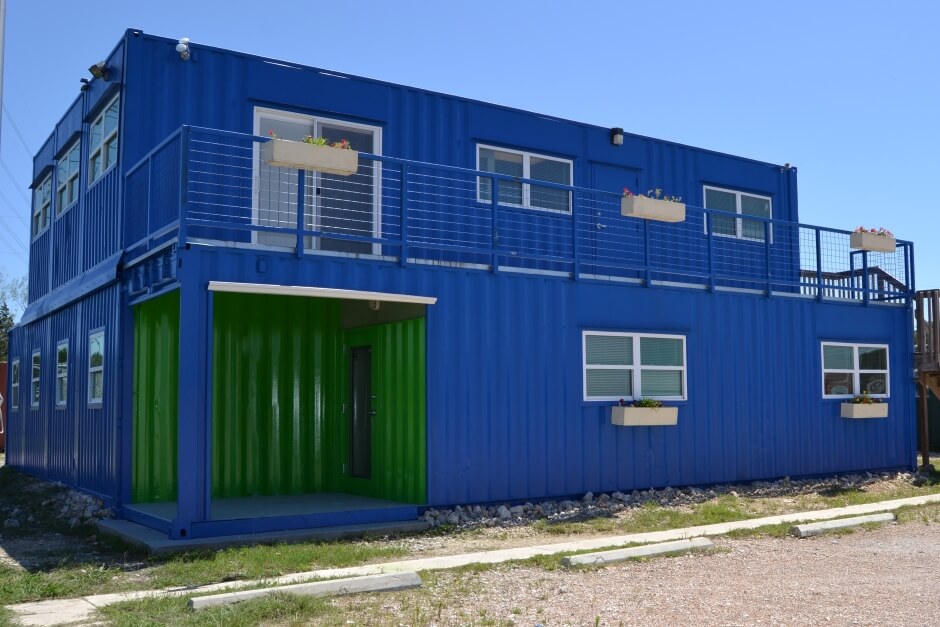 modified shipping container office painted blue and green