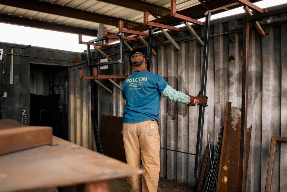 worker at modular construction manufacturing facility