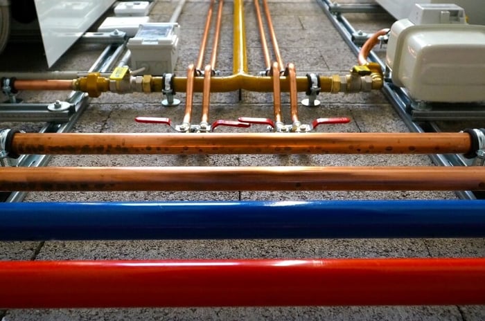 red, blue, and copper plumbing pipes