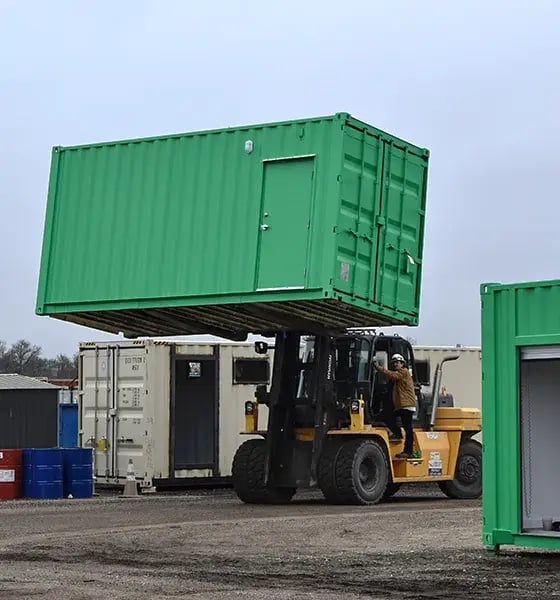 green-shipping-containet-forklift