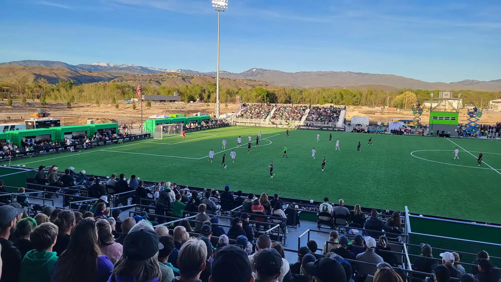 Soccer stadium with container VIP suites and container press box in the background