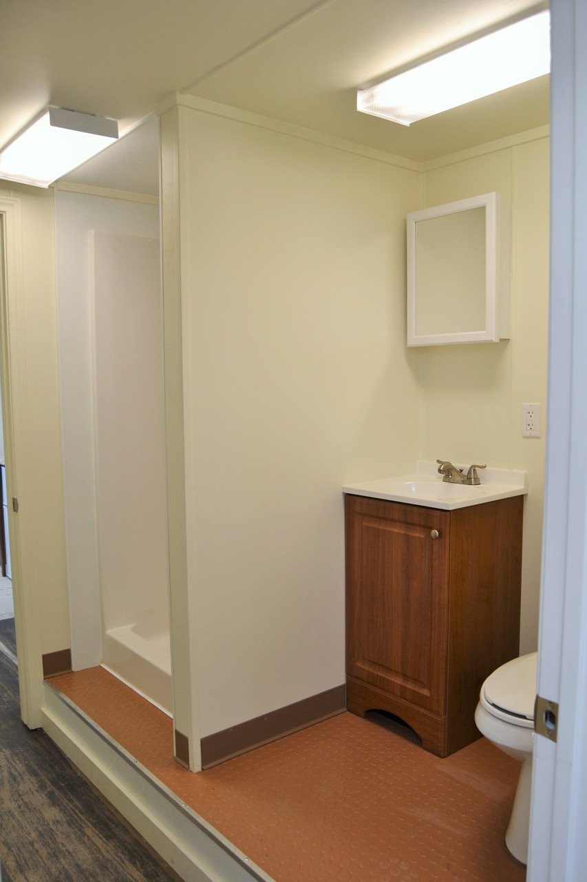 Living container bathroom with shower and vanity