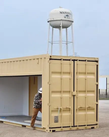 man finishing container structure