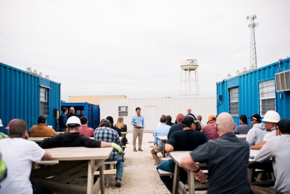 one 20-foot gray shipping container office two white 10-foot shipping container offices