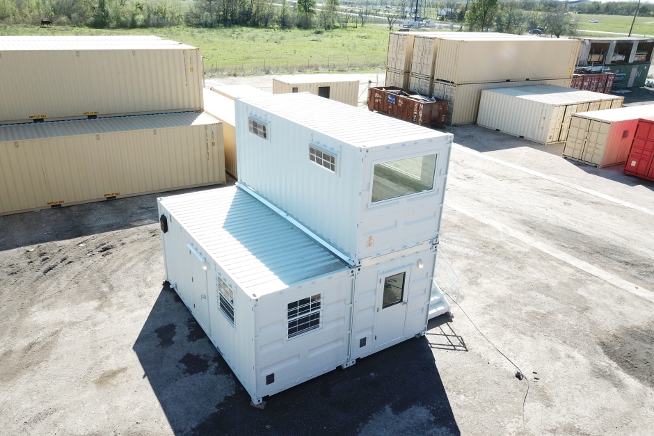 shipping containers being modified into shops in a larger structure