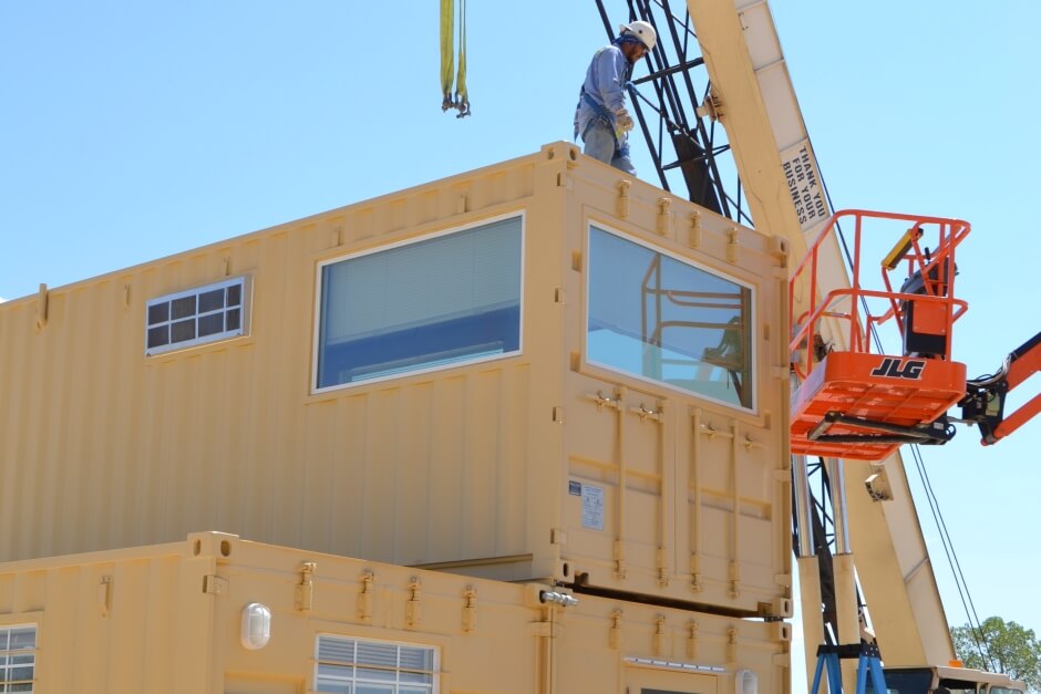 two modified shipping containers in production