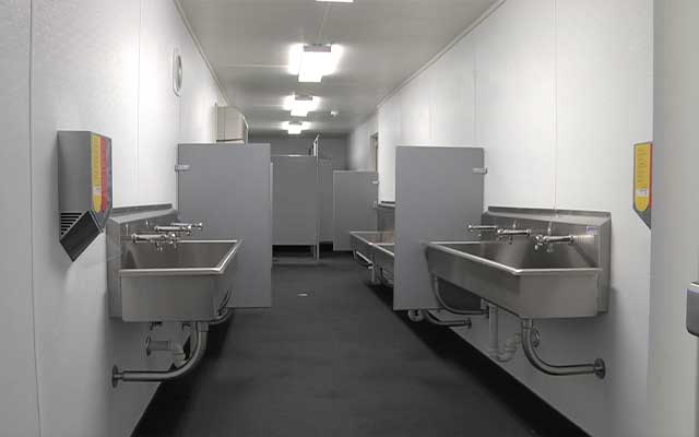 container_bathroom_with_sinks_and_stalls